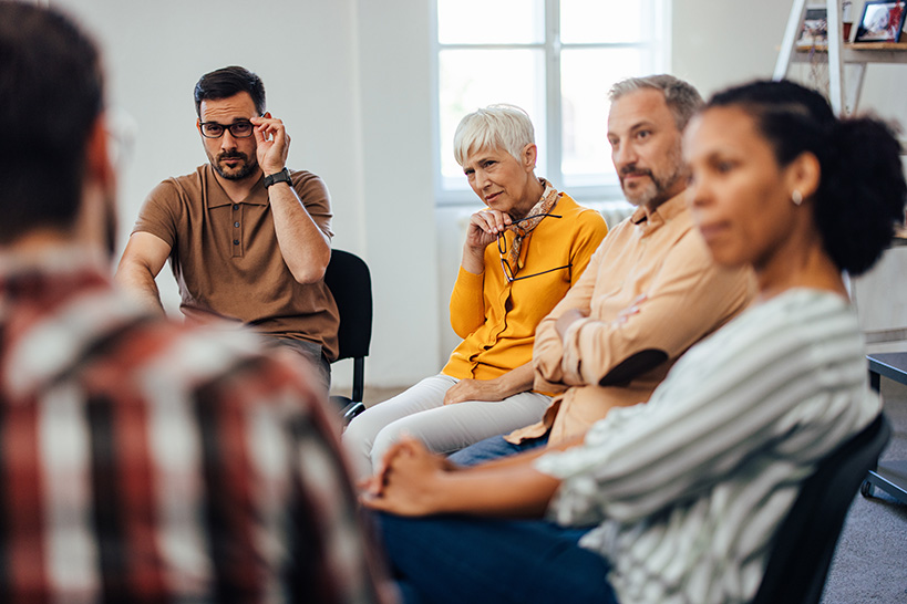 A focus group, sat in a circle.
